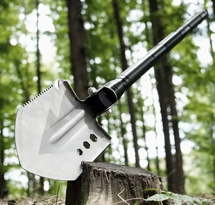 the Ultimate X2 Heavy Duty shovel standing on a tree trunk.